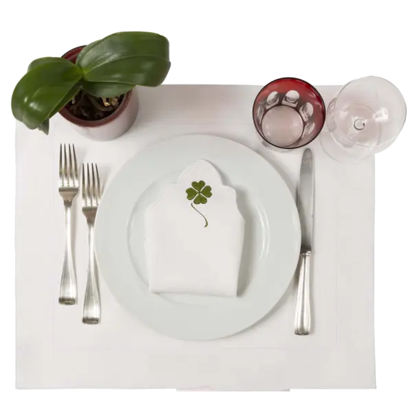Linen napkin with bright green four-leaf clover embroidery